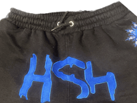 a black sweatshirt with the word hsh on it