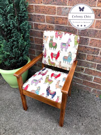 a wooden chair with a colorful llama print