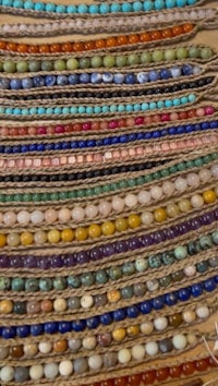 a bunch of different colored beads on a table