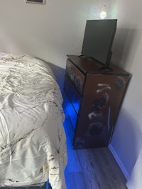 a bed in a room with a bedside table