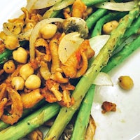 a plate of asparagus and chickpeas