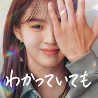 an asian girl with her hand over her face