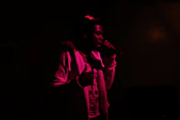 a man is singing into a microphone