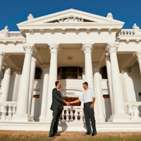 a white house with pillars