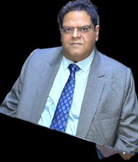 a man in a suit and tie is posing for a photo