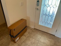 a box sitting on the floor next to a door