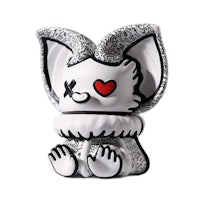 a black and white figurine with a heart on it
