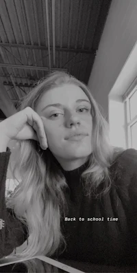 a black and white photo of a woman posing for a photo