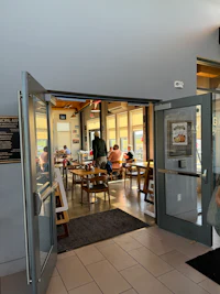 a person sitting at a table in a restaurant
