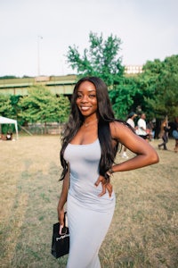 a woman in a gray dress posing for a photo