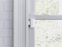 a white window with a lock on it