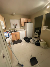 a kitchen with a refrigerator and a microwave