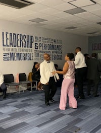 a group of people standing in a room