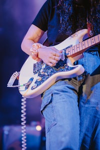 a woman playing a guitar
