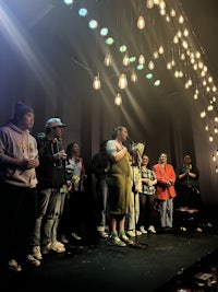 a group of people standing on a stage