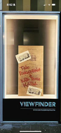 a window display with a sign that says viewfinder