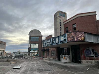 a demolished building in the middle of a deserted street