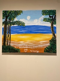 a painting of a beach scene on a wall