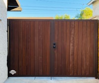 a wooden gate in a backyard
