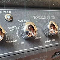a close up of the knobs on a guitar amplifier