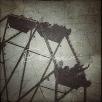 a ferris wheel on a grungy background