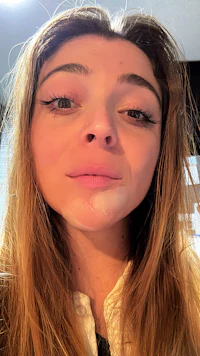 a woman is taking a selfie with her eyes wide open