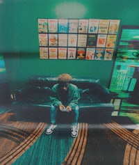 a man sitting on a couch in a room