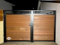 a wooden gate with a metal frame