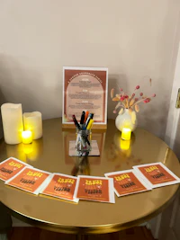 a table with books and candles on it
