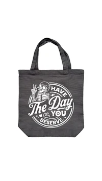 a gray tote bag with a skeleton on it