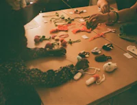 a group of children are making crafts at a table