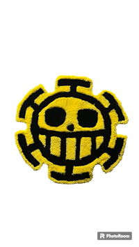 a yellow and black one piece logo on a black background