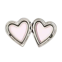 two silver heart shaped lockets on a black background