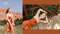 a woman in an orange dress laying on a wooden deck