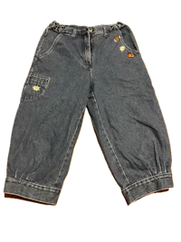 a pair of blue denim shorts with gold buttons