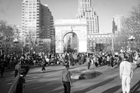 a black and white photo of a group of people in a park