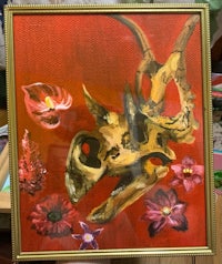 a painting of a dinosaur skull and flowers
