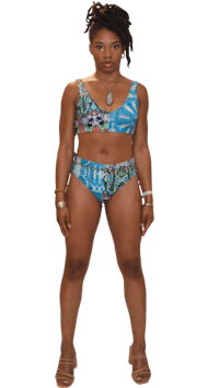 a woman in a blue bikini top and bottoms