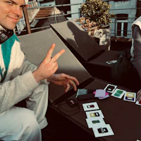 the man is wearing a white t-shirt