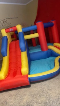 a large inflatable bounce house with a slide