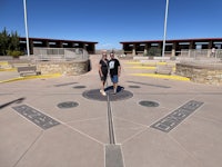 two people standing in front of a circular walkway