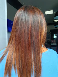 the back of a woman's hair in a salon