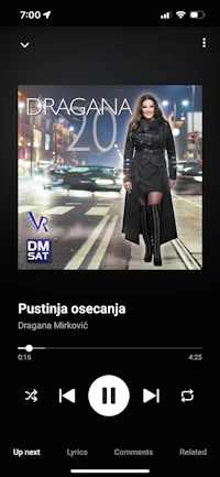 a screenshot of a music app with a woman in a black dress