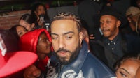 a man with a beard in a crowd of people