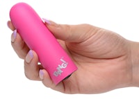 a woman's hand holding a pink vibrator