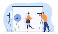 a woman and a man in front of a camera