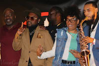 a group of people with saxophones standing next to each other