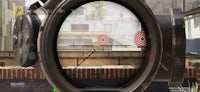 a view of a rifle scope with a target in it