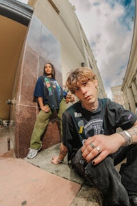 a man and a woman sitting on the steps of a building