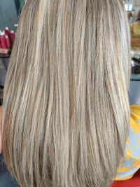 the back of a woman's hair with blonde highlights